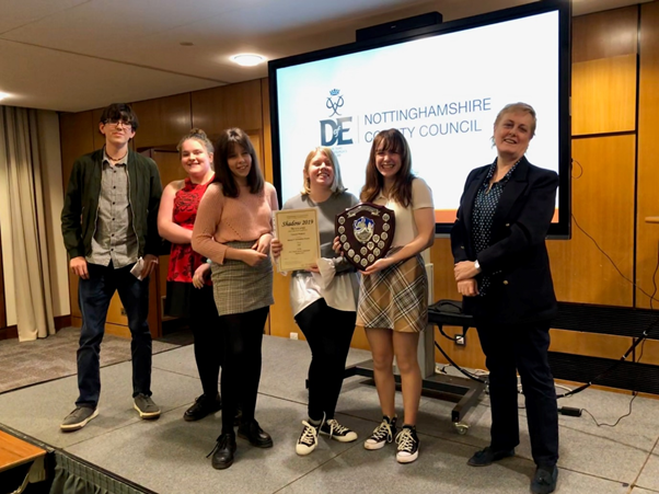 Members of the Valley Young People’s Centre present their Shadow project work, with Councillor Tracey Taylor, in 2019