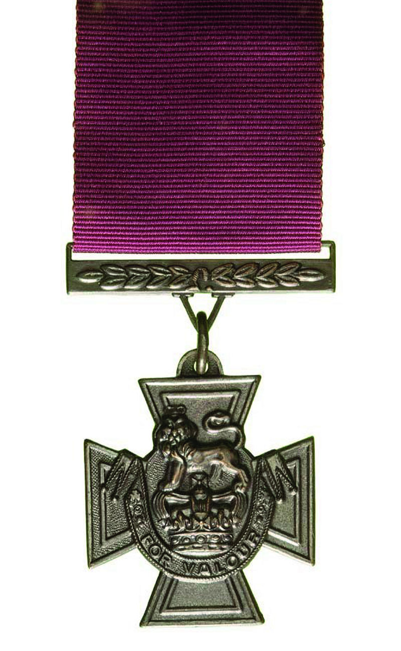 Victoria Cross medal. Bronze cross pattée woth a crimson ribbon