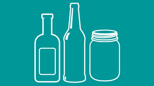 Glass bottles and a jar on a blue background