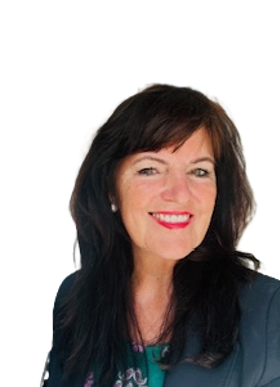 A photograph of Anne Coyle. She has dark brown hair and is wearing a blue jacket.