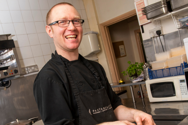 Member of staff prepping food at Pastability