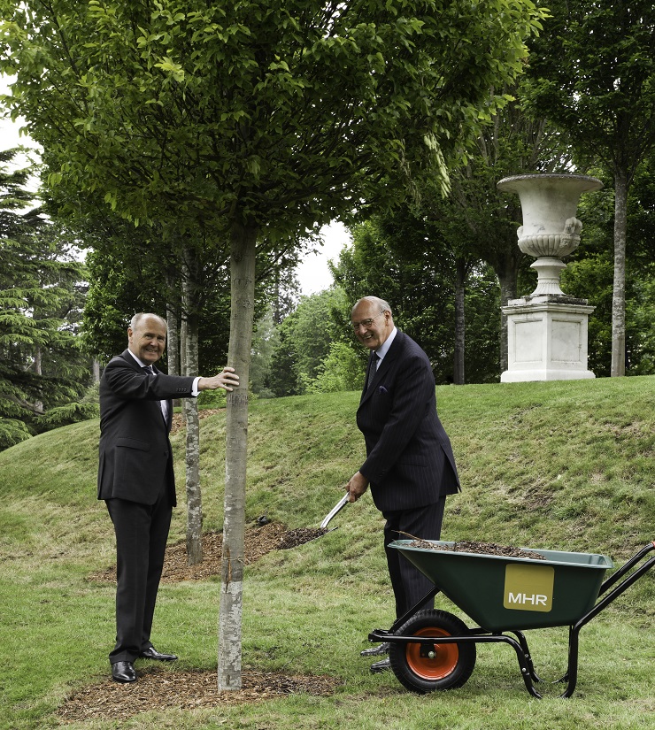 Sir John Peace and John Mills plant a tree at MHR International