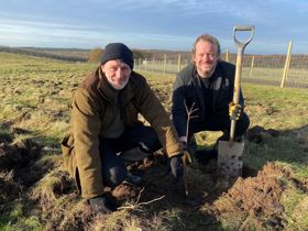 Nick Tucker, the council's Woodland Creation Project Manager and Cllr Mike Adams planting the first tree of the scheme at the ex-Rufford Colliery