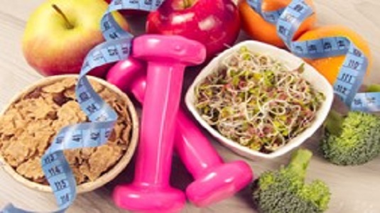 A bowl of cereal and a bowl of noodles, hand weights, a tape measure, pieces of fruit and broccoli