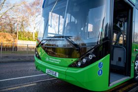 Green bus with open door