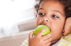 Child eating apple