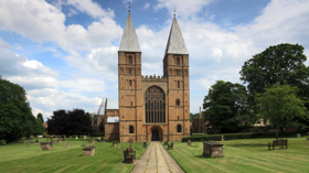 Southwell Minster on a clear day with a blue sky