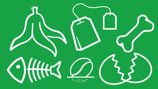 Food including a banana and a tea bag on a green background