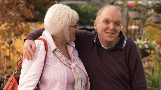 Two adults spending time together outdoors.