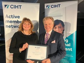 Left to right - Bikeability's Tracy Graham and Cllr Neil Clarke holding the CIHT award at the event in front of two CIHT pull up banners